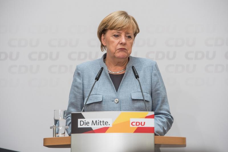 Меркель удалось удержать равновесие